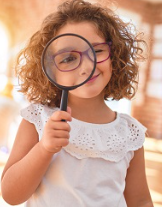 girl with magnifying glass